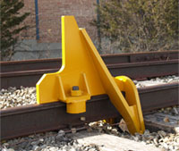 4016-06 Rail Car Stops 
Uses the cushioning capacity of the tie and a wheel-bump feature to lift the wheel slightly off the rail to absorb momentum of moving car. Recommended for industrial spur tracks which do not require a bumping post but which need more protection.